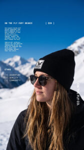 women's black On The Fly cuff beanie with bird rubber patch logo