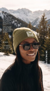 women's green On The Fly cuff beanie with bird rubber patch logo